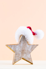 Christmas star, decor on pastel colored background. Christmas or New Year minimal concept.