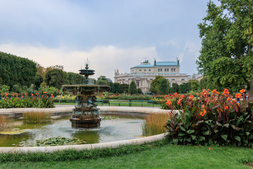 Vienna, Austria - September 1, 2019: The state Theater Burgtheater in Vienna view from a public park the Volksgarten (People's Garden) in Vienna city center, Austria