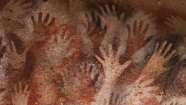 Prehistoric hand paintings at the Cave of Hands (Spanish: Cueva de Las Manos) in Santa Cruz Province, Patagonia, Argentina. The art in the cave dates from 13,000 to 9,000 years ago.