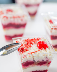 dessert layers with white cream and cherry confit with cherry