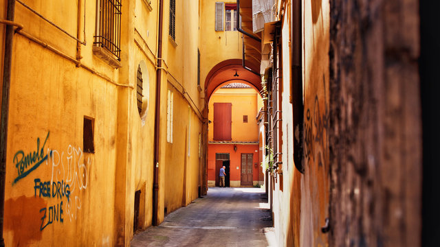 Fototapeta narrow yellow street in venice italy
