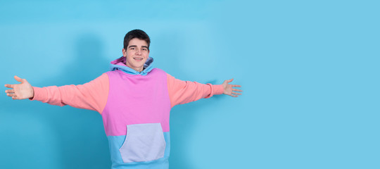 young teenage man or student isolated with open arms