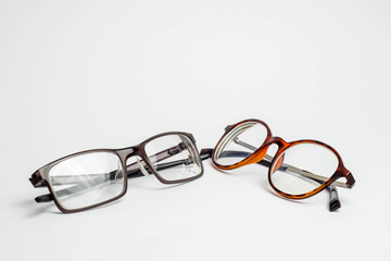 Two pairs of modern of glasses isolated in a studio shot one with black and turquoise colored frames and a blue blocking pair prescribed from a profession optometrist Copy Space Illustrative photo