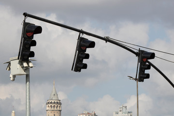 Close up of 3 traffic lights and traffic camera at the back. Photographed in Istanbul.