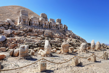 Fototapeta premium Ancient Commagene statue ruins on top of Mount Nemrut, Adiyaman, Turkey. Unesco World Heritage Site at Mount Nemrut where King Antiochus of Commagene is reputedly entombed.