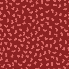 small pink hearts of different shapes on a red background.