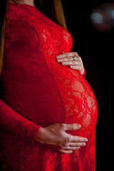 pregnant girl in a red dress