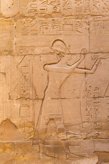 Luxor Governorate, Egypt, Karnak Temple, complex of Amun-Re. Embossed hieroglyphics on columns and walls.
