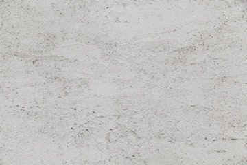 Fototapeta premium White stucco wall background for design and textures with dirty drips and stains.