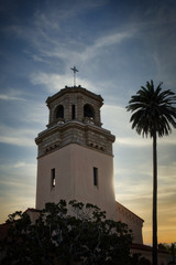 2020-02-11 A OLD CHURCH TOWER IN SOUTHERN CALIFONIA NEAR LA JOLLA WITH A SUNSET AND PALM TREE.