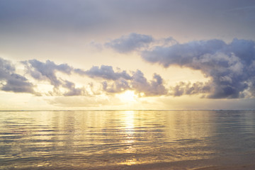 Beautiful seascape with sunrise cloudy sky.