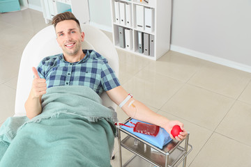Man donating blood in hospital