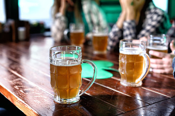 Mug of beer on table in pub. St. Patrick's Day celebration