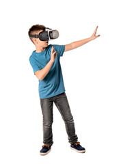 Little boy with virtual reality glasses on white background
