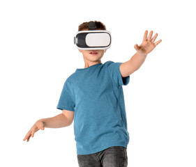 Little boy with virtual reality glasses on white background