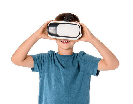 Little boy with virtual reality glasses on white background