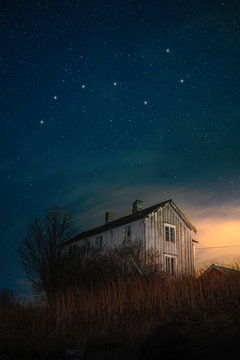 Horizontal Lanscape picture of an old house in the night sky