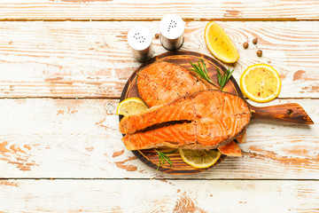 Tasty fried salmon on table