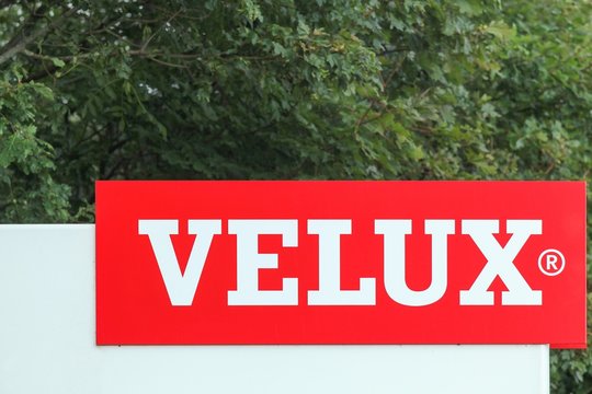 Ostbirk, Denmark - September 5, 2015: Velux logo at the entrance of a factory. Velux is a Danish company that specializes in windows and skylights