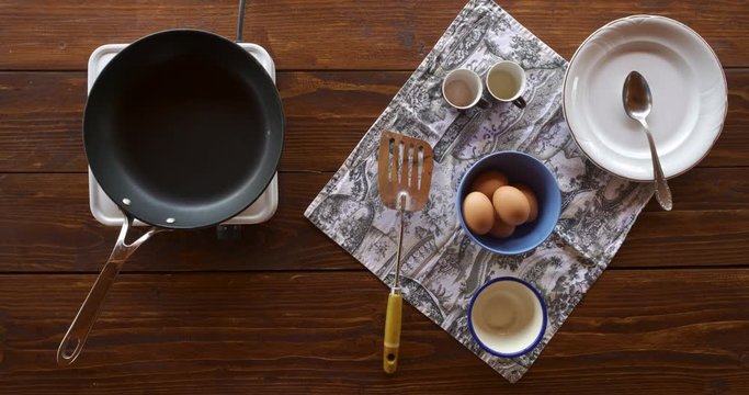 Top view food. Cooking With Mother. Beautiful Little Girl Learns How To Make Fried Egg.