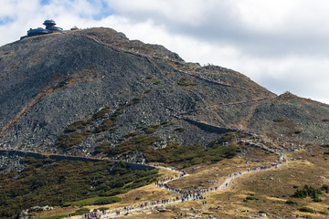 Line of tourists climbing up to Snezka, highest peak of the Krkonose/Giant Mountains, Czech republic
