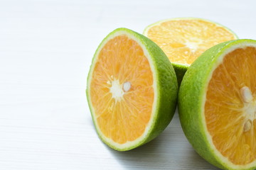 Fototapeta na wymiar fresh oranges whole and sliced