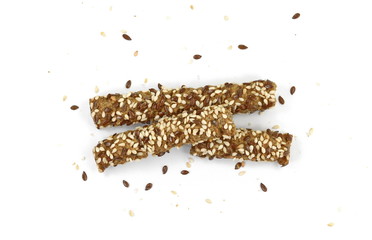 Sesame- linen stick crackers. Pretzel bread stick with sesame and linen, flax seeds isolated on white background.