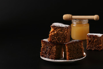 Traditional sweet honey pie on Rosh hashanah jewish New Year holiday , on a dark background, Closeup