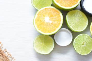 Tahiti lemons and whole and sliced oranges