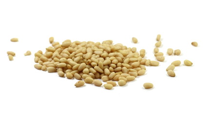 peeled pine nuts isolated on a white background 