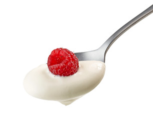 spoon of yogurt cream with raspberry