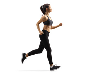 Fototapeta na wymiar Young female in black leggings jogging