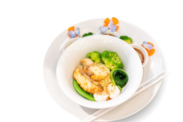 Fried fish Thai Nooble style in white bowl ready to serve and eat fot lunch or dinner.