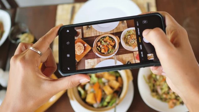 Female Hands Photographing Food By Smartphone. Social Media Concept. 4K Footage.