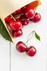 Fresh cherry on wooden white background. Red ripe cherries. 