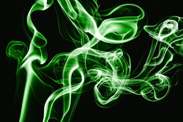 Green smoke flow isolated on black. Gas flow shape effect. Artistic color scent mist background. Empty copy space magic fume.