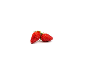 two portrait isolated fresh strawberries on the pure white backgroud in studio light. Clipping path.