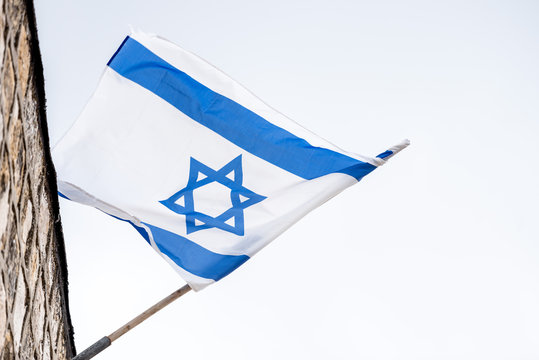 Israeli Flag Against White Sky