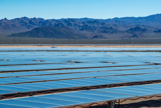 USA, Nevada, Clark County, Eldorado Valley, Boulder City. An industrial scale solar power plant facility generating renewable energy with a farm of photovoltaic panels that generate electricity