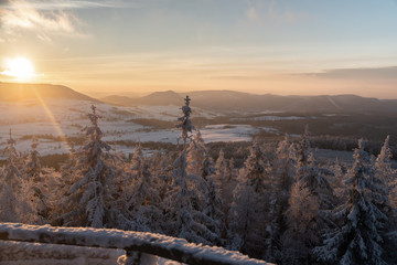 Panoramic view from Borowa Gora view point during winter time. Frosty structure, glazed, icy branches. Walbrzych in the background, Lower Silesia, Poland