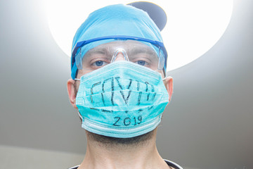 male doctor in medical mask coronavirus COVID - 2019