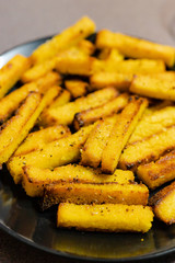 homemade vegan poelnta chips made with oat milk and cornmeal with vegan aioli sauce to the side