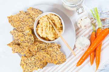 hummus and chips with black and white sesame 