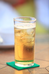 Glass of light beer on a table