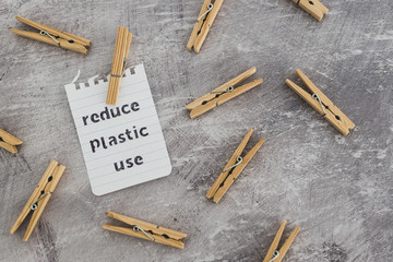 Reduce plastic use message with wooden pegs to hang the washing, sustainable living