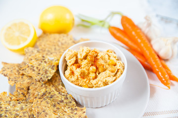 hummus and chips with black and white sesame 