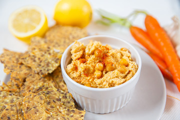 hummus and chips with black and white sesame 