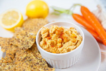 hummus and chips with black and white sesame 