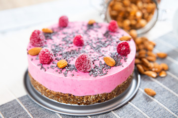 ice cream cake with raspberries, almonds and biscuits