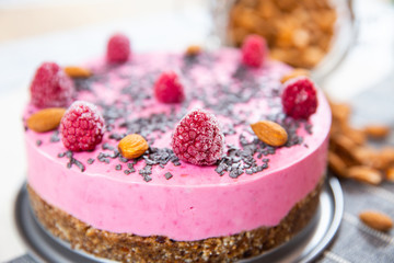 ice cream cake with raspberries, almonds and biscuits